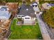 Beautiful overhead view of a manicured lawn, two-story home and detached two car garage at 412 W Vermont W Ave, Phoenix, AZ 85013