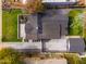 Aerial view of home featuring lush landscaping, a large lot, a driveway, and a detached garage at 412 W Vermont W Ave, Phoenix, AZ 85013