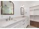 Bathroom featuring double vanity, framed mirrors, and closet space at 412 W Vermont W Ave, Phoenix, AZ 85013