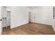 A bedroom with hardwood floors, white walls, closet with modern design elements at 412 W Vermont W Ave, Phoenix, AZ 85013