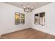 Bright dining room featuring a decorative ceiling, chandelier, and large windows at 412 W Vermont W Ave, Phoenix, AZ 85013