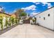 Long driveway featuring custom gate, modern home, and professional landscaping at 412 W Vermont W Ave, Phoenix, AZ 85013