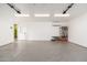 Bright and spacious garage with epoxy flooring, ample storage, and a convenient side door at 412 W Vermont W Ave, Phoenix, AZ 85013