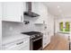 Kitchen featuring stainless steel appliances and white cabinets at 412 W Vermont W Ave, Phoenix, AZ 85013