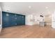 Open concept space featuring a custom blue wall and eat-in kitchen at 412 W Vermont W Ave, Phoenix, AZ 85013