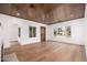 Bright and spacious living room featuring wood floors, light walls, and a stylish wood ceiling at 412 W Vermont W Ave, Phoenix, AZ 85013