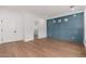Bright living room featuring hardwood floors, paneled wall, and ample natural light at 412 W Vermont W Ave, Phoenix, AZ 85013