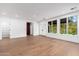 Spacious living room with wood floors, white trim and a view to the exterior at 412 W Vermont W Ave, Phoenix, AZ 85013