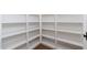 Well-organized pantry featuring ample shelving for storage and a dark wood floor at 412 W Vermont W Ave, Phoenix, AZ 85013