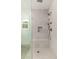 Modern walk-in shower with rainfall showerhead, built-in bench, and tile surround at 412 W Vermont W Ave, Phoenix, AZ 85013