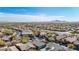 Scenic aerial view of the community showcasing its winding roads, desert landscaping, and mountain views at 41216 N Shadow Creek Ct, Anthem, AZ 85086