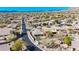 Scenic aerial view of a desert community showcasing landscaping, private yards, and mountain views in the distance at 41216 N Shadow Creek Ct, Anthem, AZ 85086
