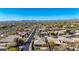 Scenic aerial view of a well-planned community with mature landscaping and mountain backdrop on a clear day at 41216 N Shadow Creek Ct, Anthem, AZ 85086