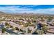 Expansive aerial view of a desert community with mountain views, mature trees, and well-maintained landscaping at 41216 N Shadow Creek Ct, Anthem, AZ 85086
