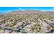 Wide angle aerial view of a desert community nestled in a lush landscape, featuring a golf course and mountain views at 41216 N Shadow Creek Ct, Anthem, AZ 85086