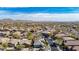 Aerial view of a desert community featuring mountain views and tile roofs at 41216 N Shadow Creek Ct, Anthem, AZ 85086