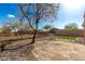 Beautiful backyard with a patio and desert landscaping and a small patch of artificial turf at 41216 N Shadow Creek Ct, Anthem, AZ 85086