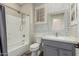 Well-appointed bathroom featuring updated vanity, bathtub with shower, and modern fixtures at 41216 N Shadow Creek Ct, Anthem, AZ 85086