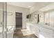 Bathroom with double sinks, a bathtub, and a shower with a glass door at 41216 N Shadow Creek Ct, Anthem, AZ 85086