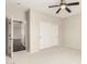 Bedroom with plush carpet, ceiling fan, and sliding closet doors at 41216 N Shadow Creek Ct, Anthem, AZ 85086