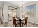 Dining room with sliding doors leading to the patio area with lots of natural light at 41216 N Shadow Creek Ct, Anthem, AZ 85086