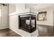 Contemporary fireplace with a modern design nestled between two large windows with lots of natural light at 41216 N Shadow Creek Ct, Anthem, AZ 85086