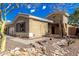 Beautiful desert home features low-maintenance landscaping, and a welcoming front facade at 41216 N Shadow Creek Ct, Anthem, AZ 85086