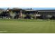 Well-maintained golf course with vibrant green grass and meticulously placed flags marking the holes at 41216 N Shadow Creek Ct, Anthem, AZ 85086
