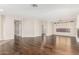 Spacious living room boasts hardwood floors, neutral walls, and natural light from a large window at 41216 N Shadow Creek Ct, Anthem, AZ 85086