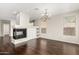 The open-concept living area features a fireplace, built-in cabinets, and a chandelier at 41216 N Shadow Creek Ct, Anthem, AZ 85086