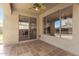 Covered patio with tile flooring and sliding glass doors providing outdoor living space at 41216 N Shadow Creek Ct, Anthem, AZ 85086