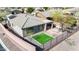 Aerial view of the home's rear exterior featuring a manicured yard, patio, and desert landscaping at 41216 N Shadow Creek Ct, Anthem, AZ 85086