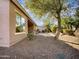 Landscaped backyard with a patio and desert landscaping at 42950 W Misty Morning Ln, Maricopa, AZ 85138