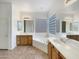 Bathroom with double sinks, a soaking tub, and large windows at 42950 W Misty Morning Ln, Maricopa, AZ 85138