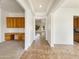 Bright entryway with tile floors and built-in wooden cabinets at 42950 W Misty Morning Ln, Maricopa, AZ 85138