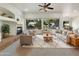 Bright living room featuring a fireplace and ample natural light at 42950 W Misty Morning Ln, Maricopa, AZ 85138