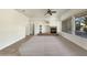 Living room with fireplace and lots of natural light at 42950 W Misty Morning Ln, Maricopa, AZ 85138
