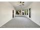 Bright and airy main bedroom with large windows and plush carpet at 42950 W Misty Morning Ln, Maricopa, AZ 85138