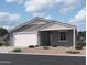 Single-story home with a two-car garage and attractive landscaping at 4509 S 95Th Dr, Tolleson, AZ 85353