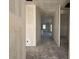 View down open hallway, showcasing new construction with unfinished walls at 4509 S 95Th Dr, Tolleson, AZ 85353