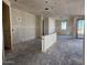 Expansive living room featuring unfinished walls and large windows for natural light at 4509 S 95Th Dr, Tolleson, AZ 85353