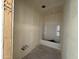 Bathroom has drywall walls and a new tub ready for customization and fixtures at 4517 S 95Th Dr, Tolleson, AZ 85353