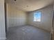 Bedroom features drywall walls and a bright window perfect for a natural light filled space at 4517 S 95Th Dr, Tolleson, AZ 85353