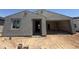 Home exterior showcases stucco and an open garage ready to be converted into a livable space at 4517 S 95Th Dr, Tolleson, AZ 85353
