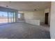 Living room featuring drywall walls and large glass doors perfect for light and access at 4517 S 95Th Dr, Tolleson, AZ 85353
