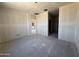 Spacious living room with open floor plan, awaiting personalization and finishing touches for a cozy atmosphere at 4517 S 95Th Dr, Tolleson, AZ 85353