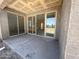 Covered patio with sliding glass doors, seamlessly blending indoor and outdoor living spaces for entertaining at 4517 S 95Th Dr, Tolleson, AZ 85353