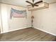 Bright bedroom with ceiling fan and light wood flooring at 7419 E Abilene Ave, Mesa, AZ 85208