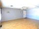 Spacious living room with light walls and wood-look flooring at 7419 E Abilene Ave, Mesa, AZ 85208