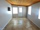 Sunroom with tile floor, wood ceiling, and exterior access at 7419 E Abilene Ave, Mesa, AZ 85208